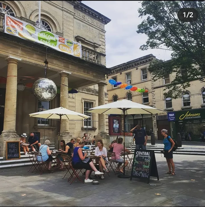 People sat at tables on the forecourt of The Sub Rooms for lunch at Central Bar and Kitchen